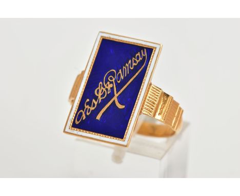 A YELLOW METAL ENAMEL RING, of a rectangular form, decorated with a blue enamel back ground and white enamel border, undeterm