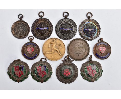 AN ASSORTMENT OF MEDALS, to include seven cycling medals, three running medals and two tricycle medals, awarded to 'M J Dunn 