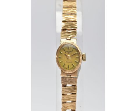 A LADYS 9CT GOLD 'ROTARY' WRISTWATCH, hand wound movement, oval gold dial signed 'Rotary, 21 jewels', baton markers, textured