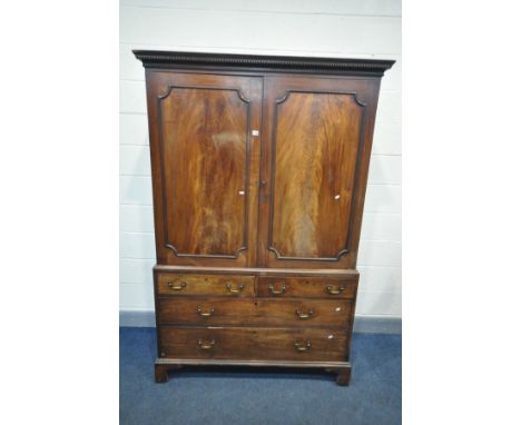 A GEORGIAN FLAME MAHOGANY LINEN PRESS, the double panelled door enclosing an altered interior, including three shortened slid