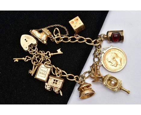 A 9CT GOLD CHARM BRACELET WITH HALF SOVEREIGN CHARM, curb link bracelet, each link stamped 9.375, suspending ten charms such 