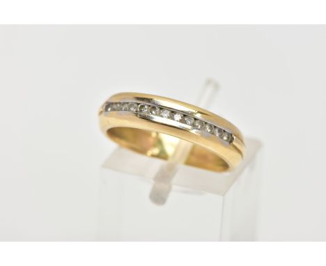 AN 18CT GOLD DIAMOND HALF ETERNITY RING, designed with a row of channel set round brilliant cut diamonds, the band engraved w