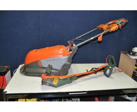 A FLYMO HOVER COMPACT 330 LAWN MOWER and a Black and Decker strimmer (both PAT pass and working)