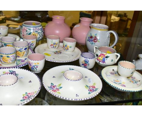 A QUANTITY OF POOLE POTTERY EGG CUPS AND OTHER PIECES, to include eight complete egg cup sets, nine individual egg cups, inco