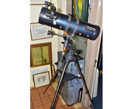 A BOXED CELESTRON TELESCOPE, AstroMaster 130EQ MD, 130mm Newtonian reflector telescope with tripod, motor drive and instructi