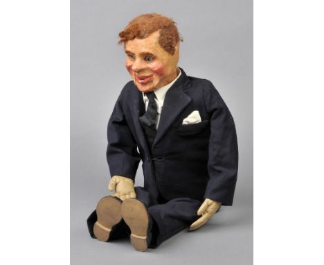 *Ventriloquism. A ventriloquist's dummy, circa 1930s,  painted papier-mache head, with articulated eyes and mouth, wooden fra