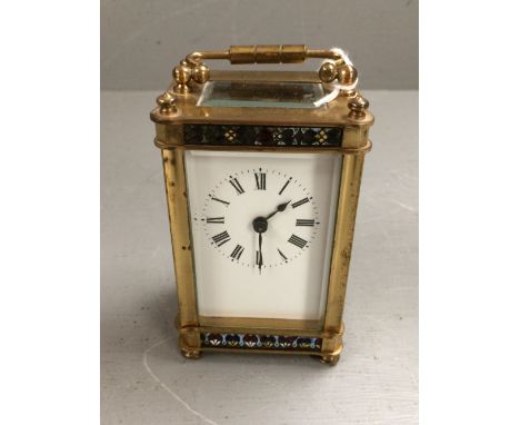 Small brass carriage clock with enamelled banding 