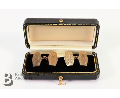 A pair of gentleman's 9ct gold cufflinks, having engine-turned decoration, in the original box, approx 12 gms.&nbsp;