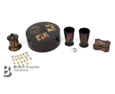 Japanese black lacquer, including two dice throw and a small pot and cover containing miniature bone dominoes. This lot inclu