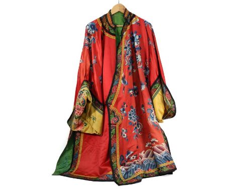 Chinese red silk and satin front opening jacket with mandarin collar, early 20th century, embroidered with various blue colou