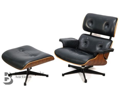 Charles and Ray Eames-style black leather swivel action recliner and footstool. The chair having palisander wood veneered she