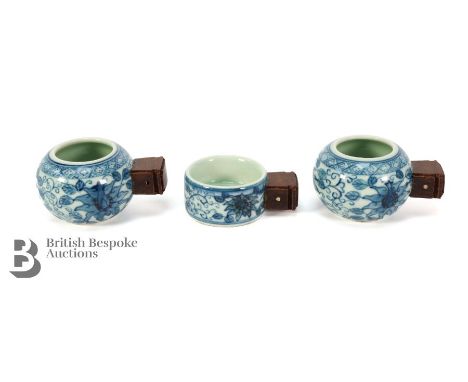 Three blue and white miniature cruet with wooden handles, Artemis leaf to the base, blue foliate design heightened with red e