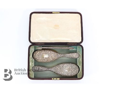 Edward VII boxed silver vanity set, London hallmark dated 1902, mm Mappin Bros, comprising two hairbrushes and a comb, togeth