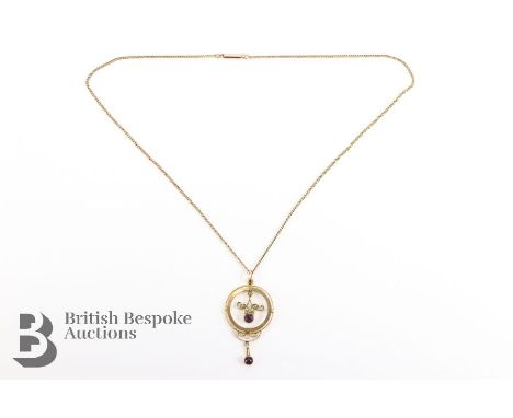 9ct Edwardian amethyst seed pearl pendant, 4 gms suspended from a 9ct gold chain, approx 4 gms. The pendant measures includin