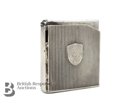 A cigarette lighter for the classic Ferrari owner, silver plated finish circa 1950s/1960s with Ferrari prancing horse motif. 