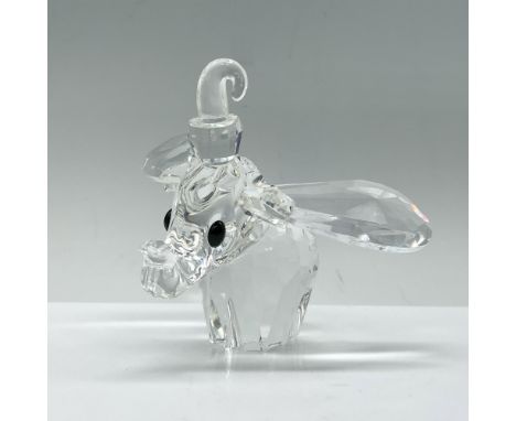 A clear crystal Dumbo, featuring a raised trunk and ears, adorned with striking black crystal eyes. Swarovski backstamp. Incl