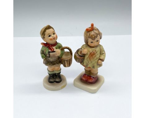 Hand painted and hand made porcelain Hummel figures; a boy and a girl with a basket. Goebel backstamps. Village Boy: HUM 51; 