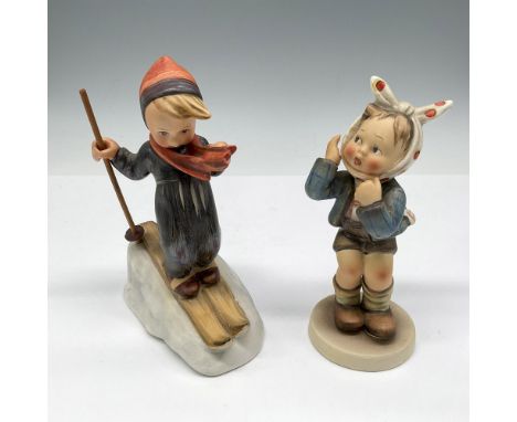 Hand painted figures colored in gray, blue, orange and brown. Lot includes Skier 59 and Boy with Toothache 217. Goebel Hummel