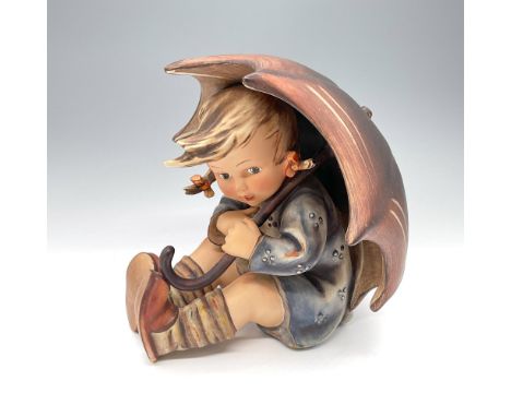 This classic figurine depicts a hand-painted young girl hiding under an umbrella. Goebel backstamp to base. Issued: 20th cent