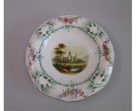 A H & R Daniel low comport with a hand painted scene to the centre and a green and puce decorated rimDate  1825Size   25cm di