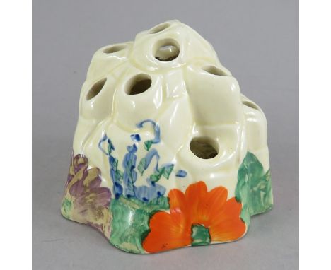 An early twentieth century Art Deco Wlikinson Pottery Clarice Cliff posy holder, c. 1930. It is hand-painted with flowers and