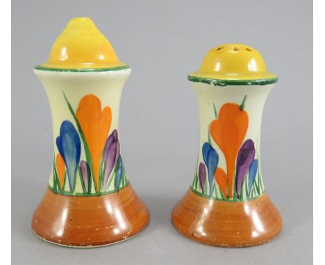 A pair of early twentieth century Art Deco Newport Pottery Clarice Cliff pepper and salt pots, c. 1930. They are hand-painted
