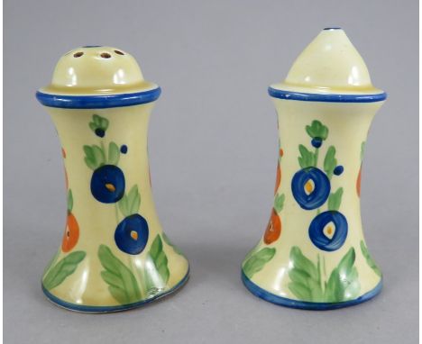 A pair of early twentieth century Art Deco Newport Pottery Clarice Cliff pepper and salt pots, c. 1930. They are hand-painted