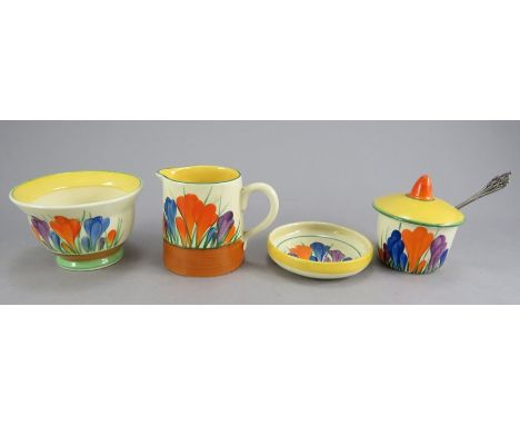 An early twentieth century Art Deco Newport & Wilkinson Pottery Clarice Cliff Crocus pattern wares, c. 1930. To include a cre