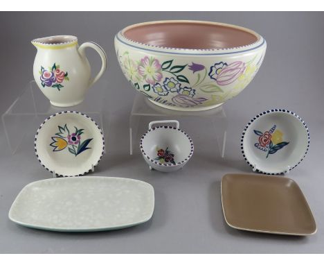 A collection of twentieth century Poole pottery wares. To include: three small bowls, a larger bowl, a small jug and two smal