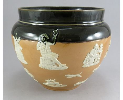 A nineteenth brown glaze stoneware sprig moulded Doulton Lambeth medium sized jardiniere, c. 1880. It is decorated with a var