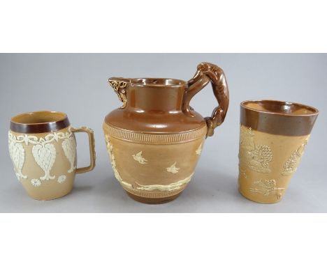 Three nineteenth brown glaze stoneware sprig moulded Doulton Lambeth pieces, c. 1880. To include: a barrel-shaped mug, a tave