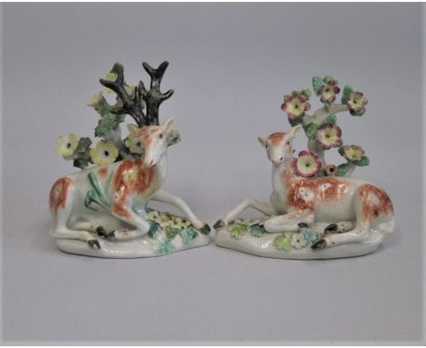 A Pair of Derby Stag and Doe recumbent before the bocage Date circa 1765   patch marks Size;  12cm high Condition;  bocages, 