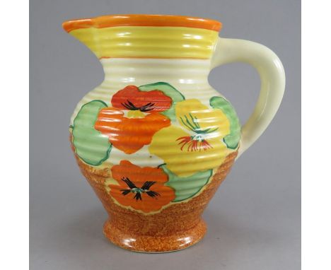 An early twentieth century Art Deco Newport Pottery Clarice Cliff Nasturium jug, c. 1930. It is hand-painted with flowers and