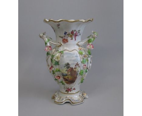 A H&R Daniel Vase decorated with floral encrusted handles  with hand painted scenesDate  circa  1825Size 24cm high  Condition