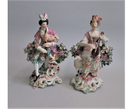 Pair of Derby Seated Musician figures , He playing a pipe she playing a mandolinDate circa 1765  patch marksSize  16cm high C