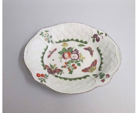 A Chelsea Red Anchor Oval Dish with basket weave moulding painted with cut fruit and butterfliesDate circa 1756-58  Red ancho