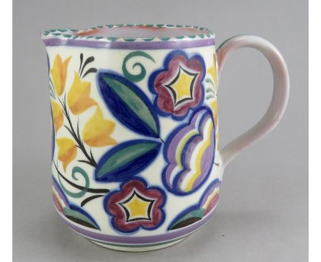 An early twentieth century Poole Pottery handled jug, c. 1926. It is decorated with a floral pattern designed by Truda Adams 
