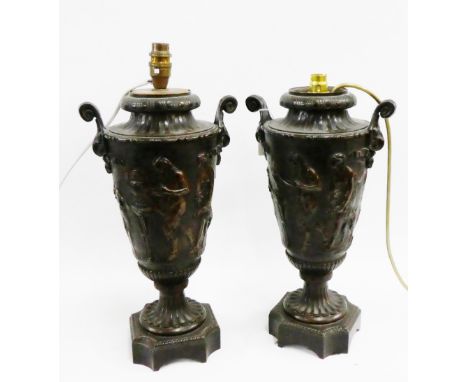 Pair of bronze table lamp bases with a frieze of classical figures in relief, 38cm high, excluding fittings, (2) 