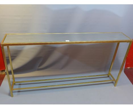 An Art Deco style gilt metal console table with mirrored glass top. 