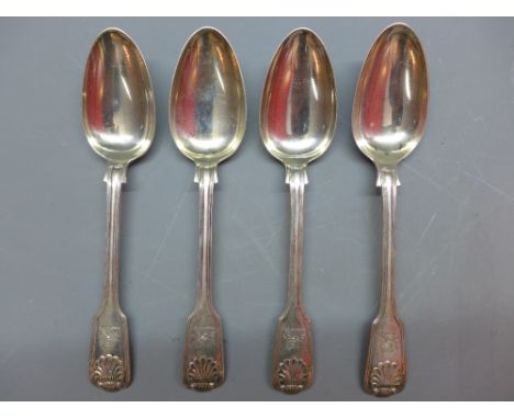 A pair of silver serving spoons, fiddle and thread style with shell decorative and lion, horseshoe and arrow engraving. Londo