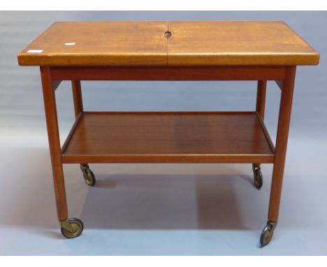 A 20th Century Danish Dansk design drinks trolley having shelf beneath and on castor feet 45cm x 85cm 