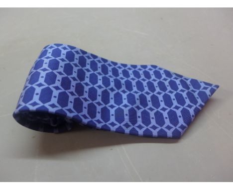 A gentlemen's silk Hermes tie in dark blue with lighter blue decoration