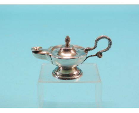 A novelty silver club lighter, in the form of an ancient oil lamp with serpent handle, Goldsmiths & Silversmiths Co., circa 1