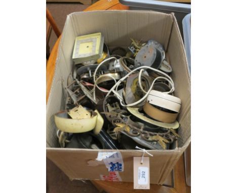 A quantity of mantel clock dials and movements, as viewed 