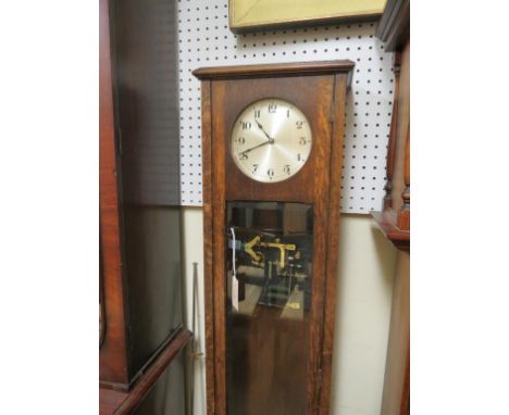 An early 20th century electric longcase clock, with silvered dial, bevelled glass trunk door, with pendulum,  5ft. 3in. high 