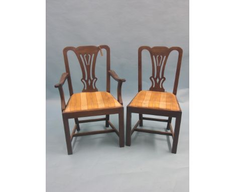A set of eight Chippendale-style mahogany dining chairs, including pair of carvers, shaped top rails and pierced splats, drop