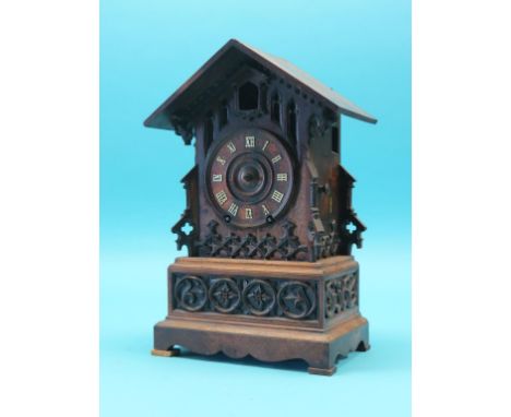 A 19th century Swiss cuckoo clock, architectural case with Gothic tracery, 15.5in., together with a small coromandel mantel c