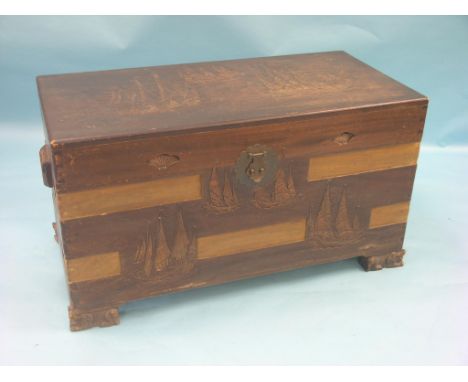 An eastern camphorwood trunk, carved with fishing vessels throughout, 3ft. 5in.