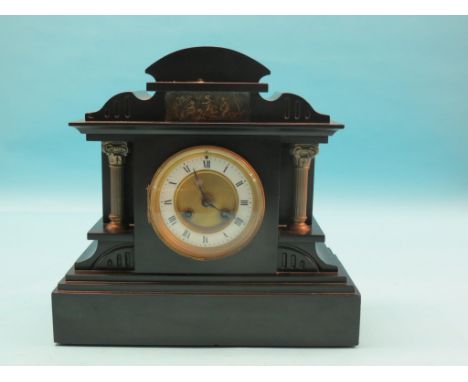 A Victorian black slate mantel clock, dial with enamelled chapter ring, Marti movement striking on a gong, architectural case