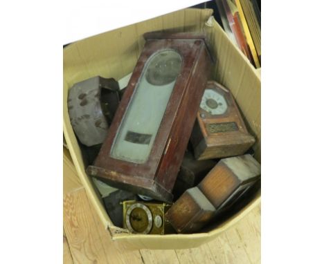 A quantity of mantel clock cases, as viewed 
